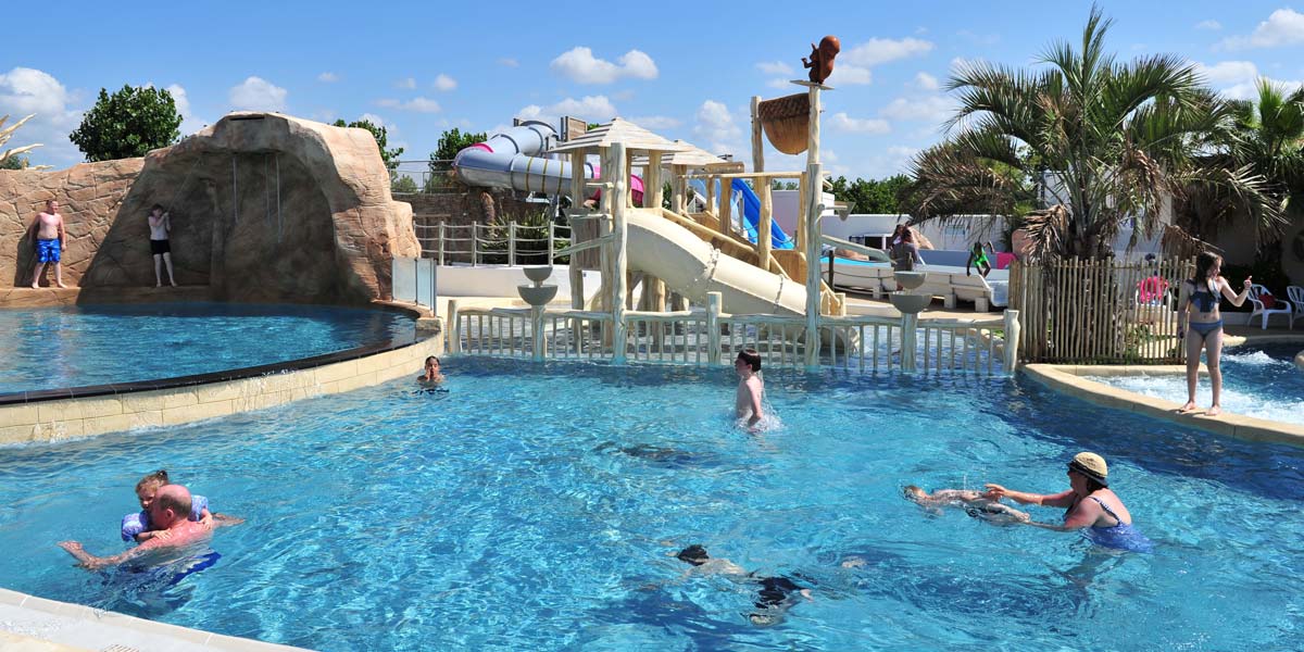 View of the aquatic area with slide in Saint-Hilaire-de-Riez at the campsite in Vendée
