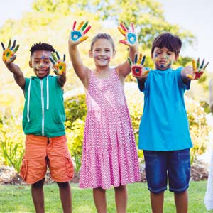 Children with painted hands at Les Écureuils campsite in Vendée