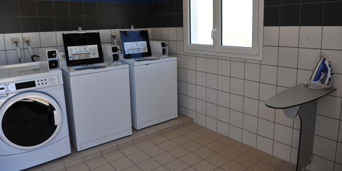 The campsite laundry room with iron and ironing board in Saint-Hilaire-de-Riez